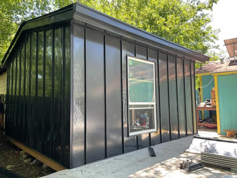 Black standing seam metal wall panels for Roof Inspection in La Joya