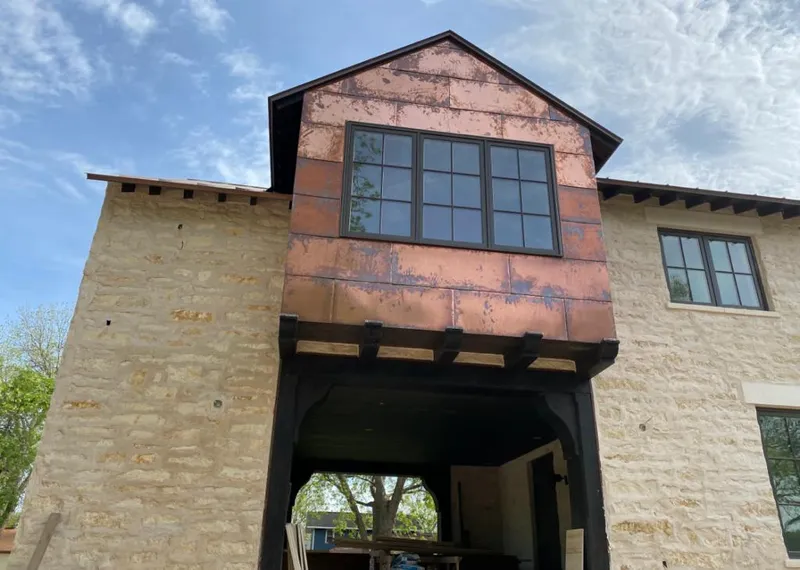 Copper metal panel facade on a stone building for Metal Roof Coating in La Joya